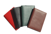 black, tan, red and green leather pocket journals